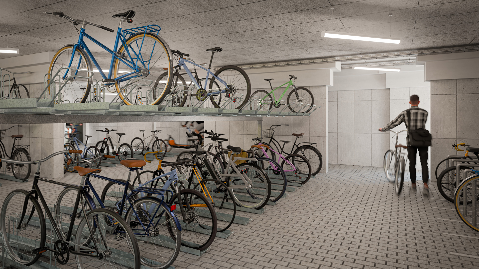 Das Bild zeigt einen modernen Fahrradkeller vom Wohnkomplex "oder" in der Oderstraße 194 in Berlin Tempelhof. Die modernen und stylischen Fahrräder werden platzsparend auf 2 Ebenen gelagert. Mehrere Bewohner holen gerade ihre Fahrräder ab.